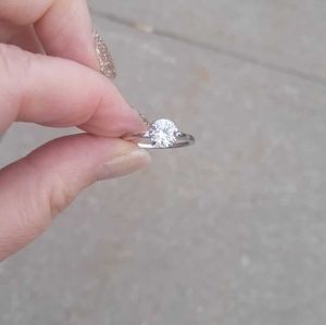 14 karat white gold and round white topaz stone ring